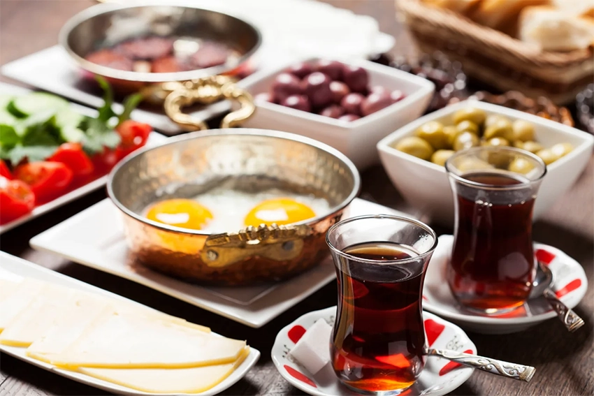Turkish tea served in tulip-shaped glass during Anatolian breakfast in Cappadocia