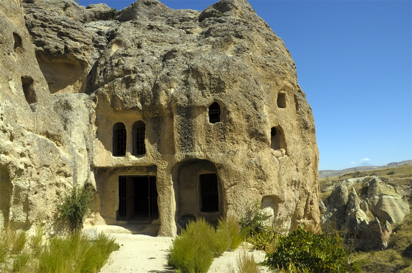 Kubbeli Church carved into a single fairy chimney with column and dome motifs