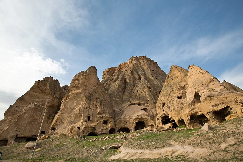 Selime Cathedral exterior view carved into cliffs at the entrance of Ihlara Valley
