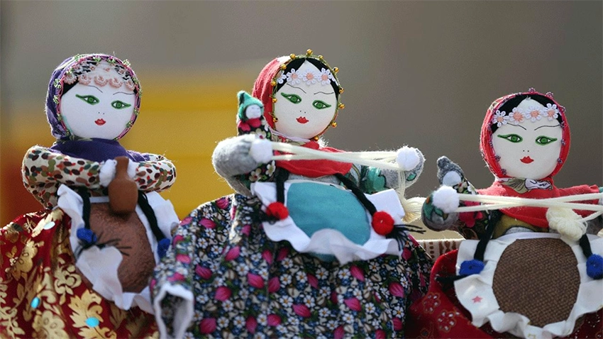 Close-up of a Soğanlı doll in traditional Anatolian costume with embroidery