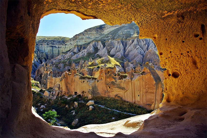Sunset view over Zelve Valley with glowing tuff formations